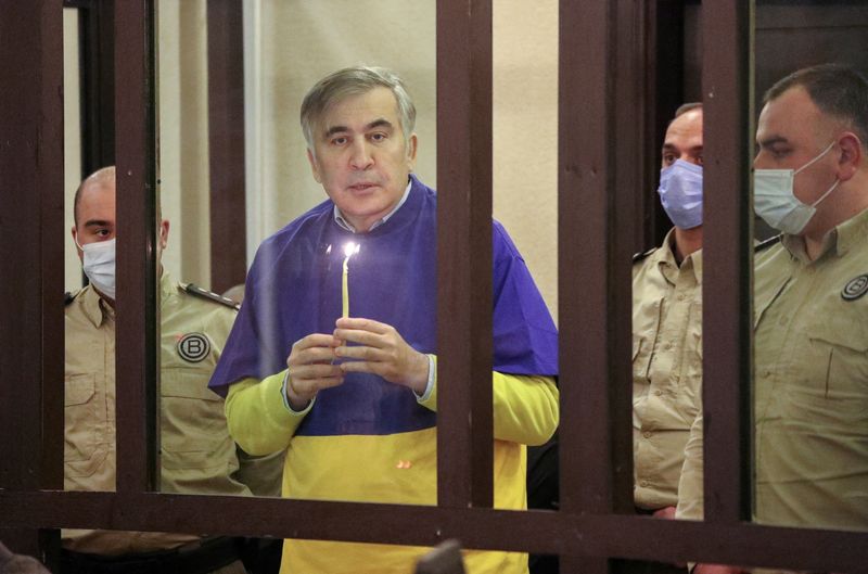 FILE PHOTO: Georgian former President Saakashvili prays for Ukraine during