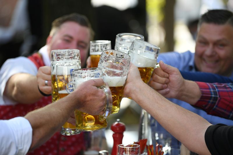 FILE PHOTO: Beer garden guests salute near Theresienwiese where Oktoberfest