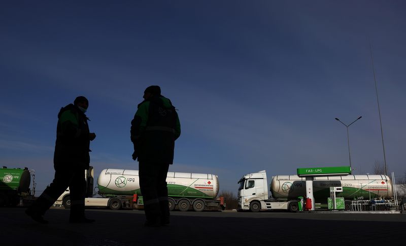 FILE PHOTO: Empty fuel trucks are parked at a gas