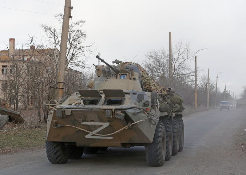 FILE PHOTO: An armoured vehicle of pro-Russian troops drives along