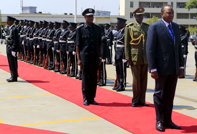 FILE PHOTO: Kenya’s President Uhuru Kenyatta inspects a guard of