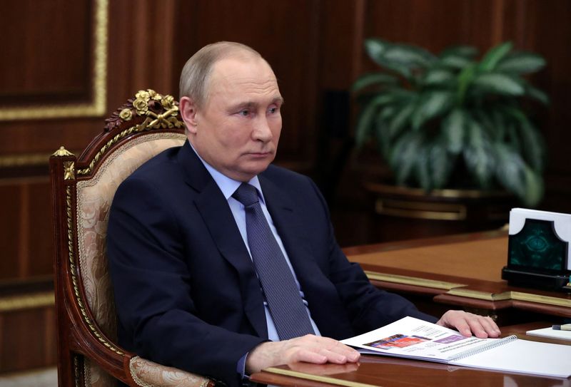 Russian President Putin attends a meeting with CEO of Znanie