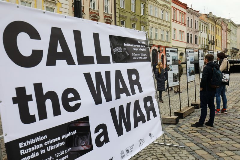 FILE PHOTO: People attend the street event “Call the War