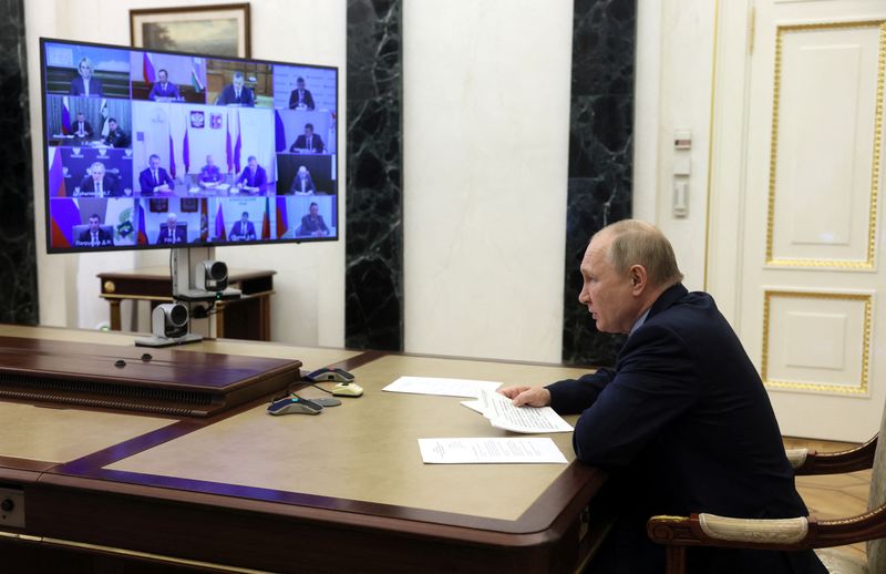 Russian President Vladimir Putin chairs a meeting on fighting wildfires,
