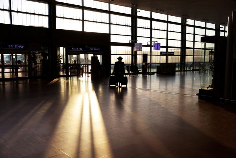 FILE PHOTO: A passenger arrives at a terminal at Ben
