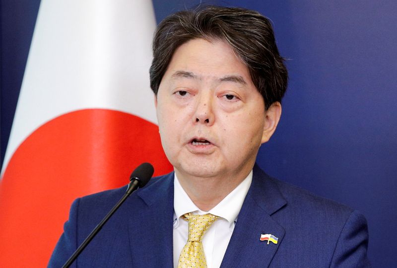 Polish and Japanese foreign ministers attend a news conference in