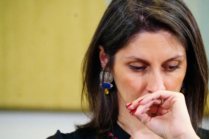 Zaghari-Ratcliffe reacts during news conference in London