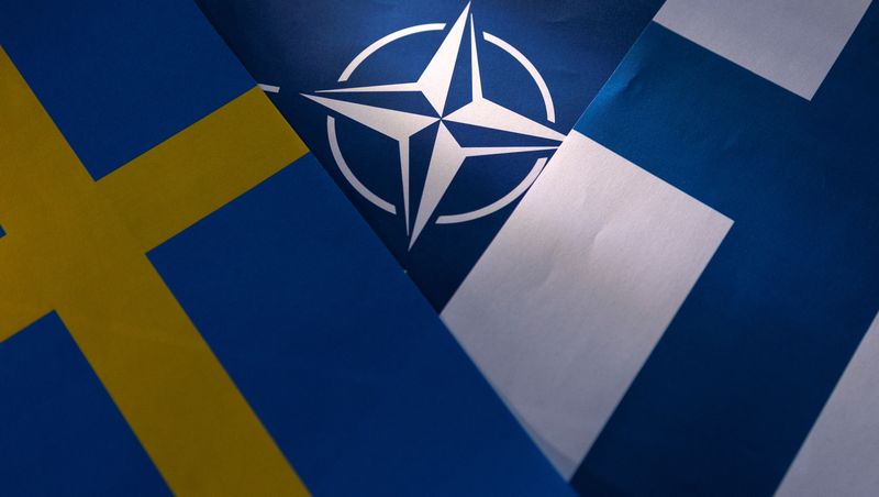 Illustration shows NATO, Swedish and Finnish flags