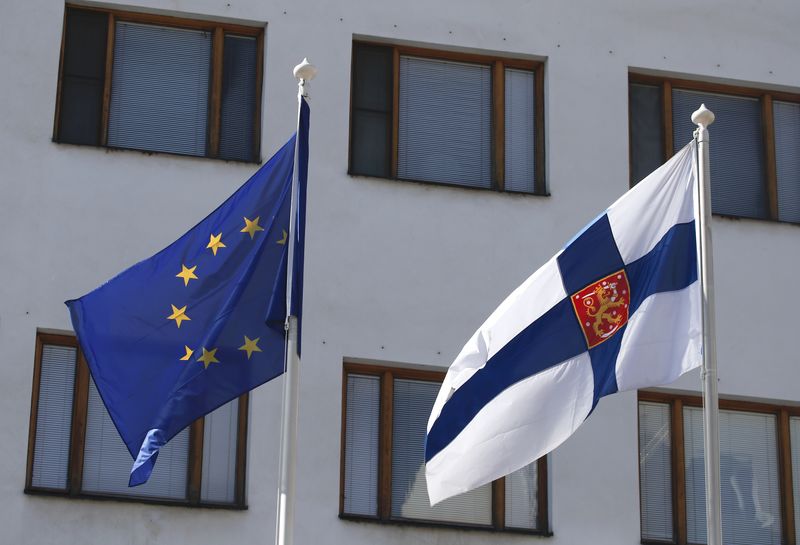 FILE PHOTO: Flags of European Union and Finland fly outside