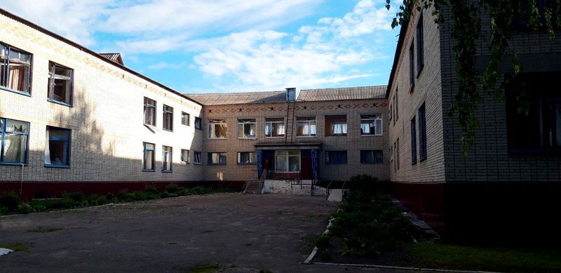 Destroyed buildings are seen following a milotary strike in Okhtyrka