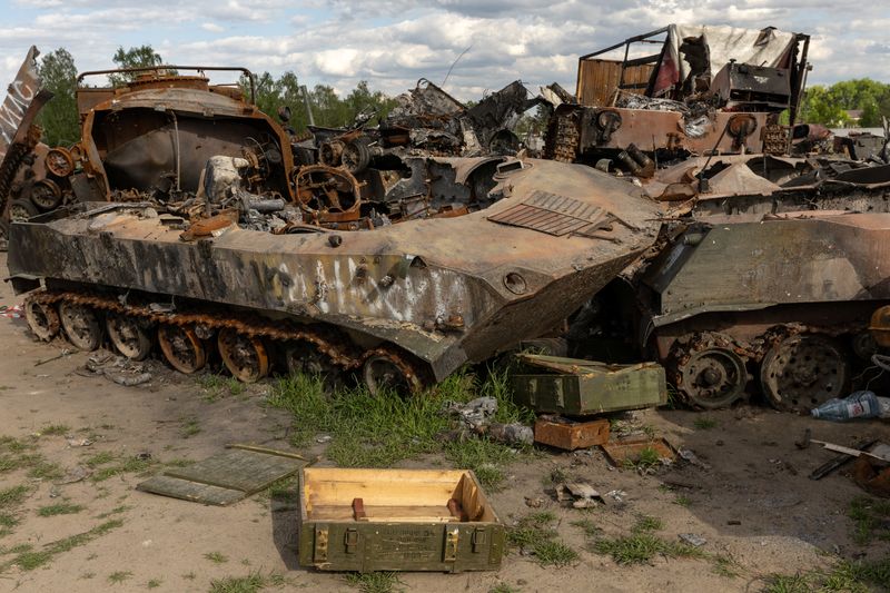 Destroyed Russian tanks and military vehicles are seen dumped in