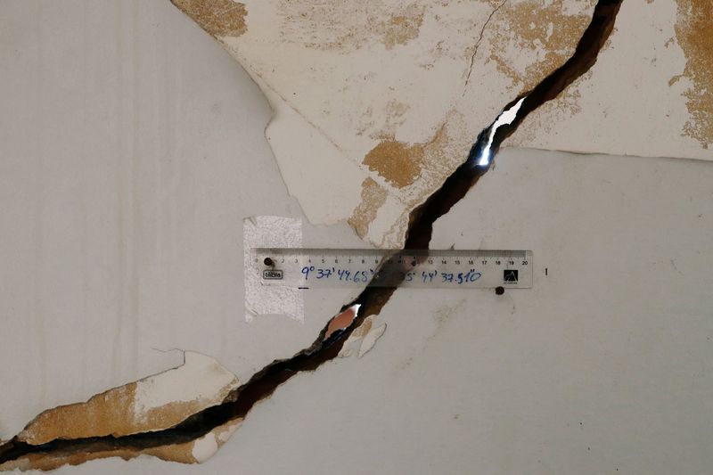 FILE PHOTO: A crack monitor is attached to the wall