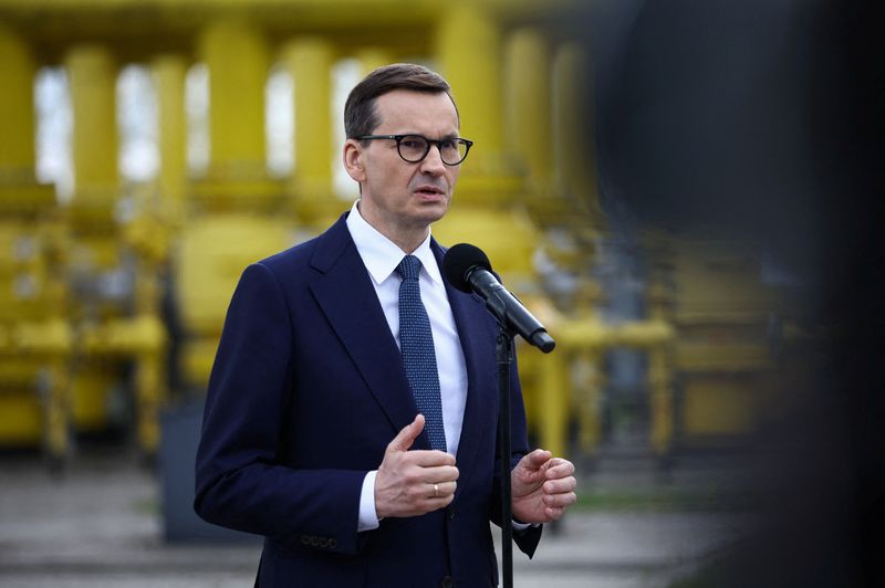 Poland’s Prime Minister Mateusz Morawiecki speaks during a news conference
