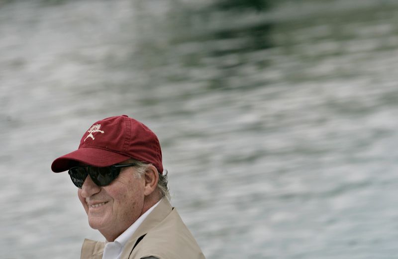 Spain’s King Juan Carlos smiles aboard the yacht “Bribon” during