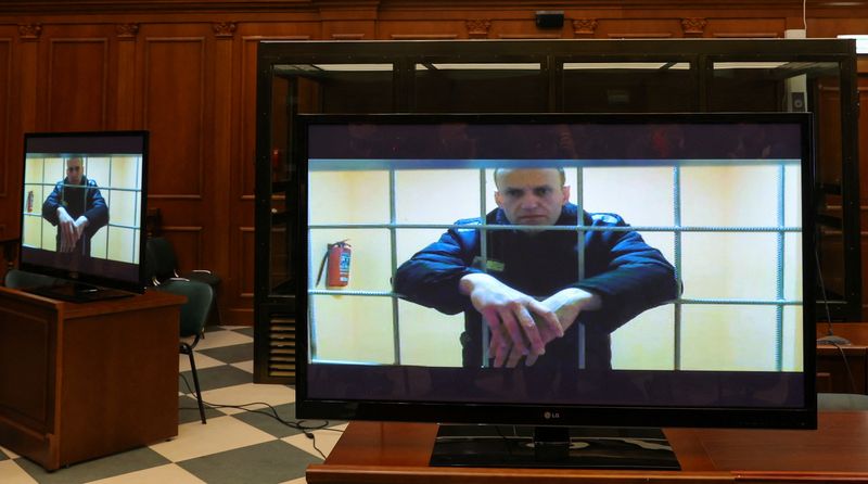 Jailed Russian opposition leader Alexei Navalny is seen on screens