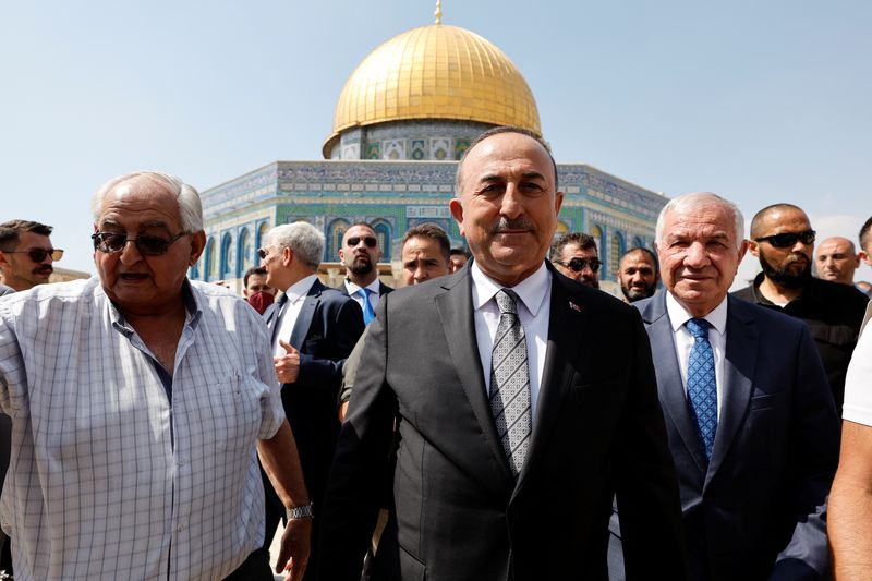 Turkish Foreign Minister Mevlut Cavusoglu visits the compound that houses