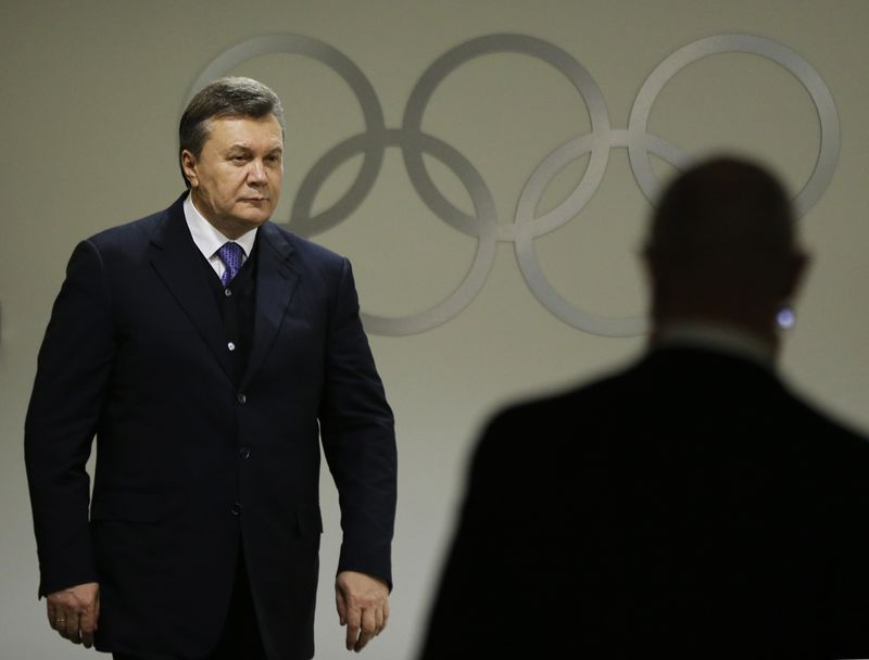 FILE PHOTO: Ukrainian President Viktor Yanukovych walks through the presidential