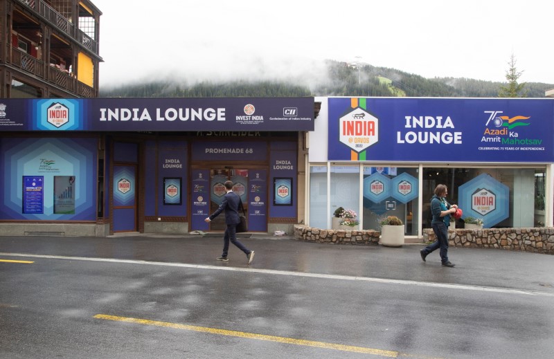People walk past the India Lounge in Davos