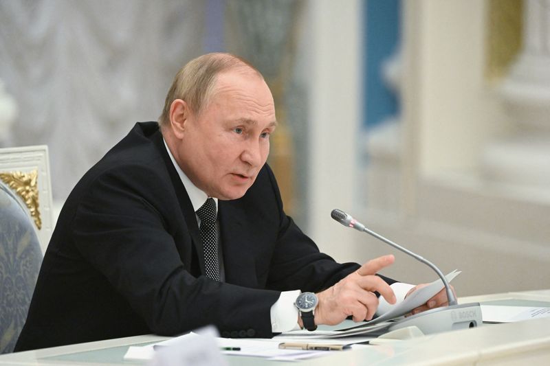 FILE PHOTO: Russian President Vladimir Putin chairs a meeting of