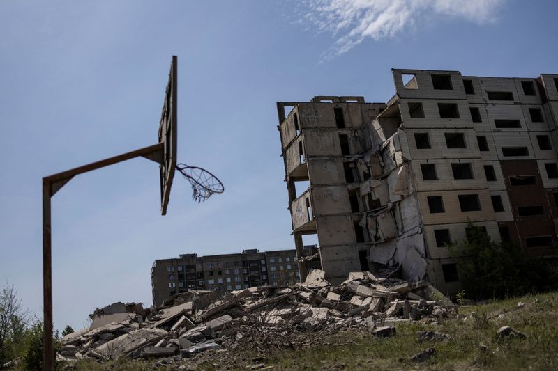An abandoned building damaged in a missile strike, amid Russia’s