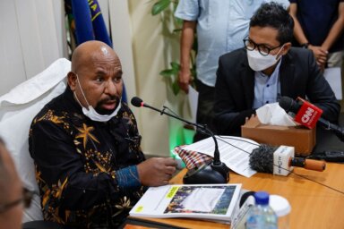Papua Governor Lukas Enembe speaks during a meeting in Jakarta