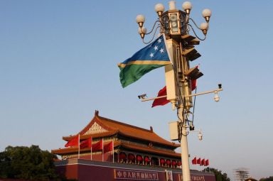 FILE PHOTO: National flags of Solomon Islands and China flutter