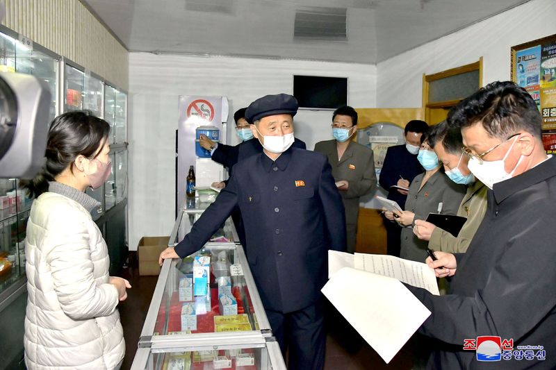 North Korea’s Premier Kim Tok Hun, inspects a pharmacy amid